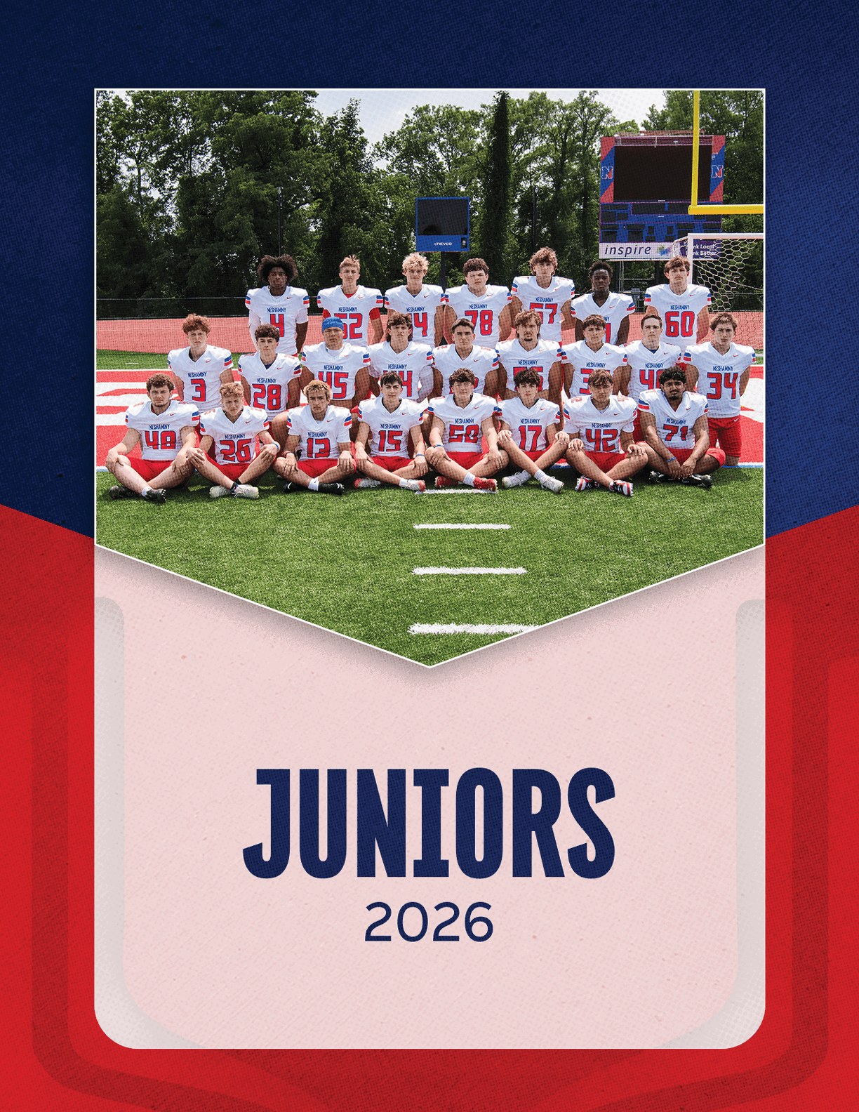A group of people wearing white sports jerseys with red numbers pose on a football field with the text juniors 2026 below them. Description generated by AI