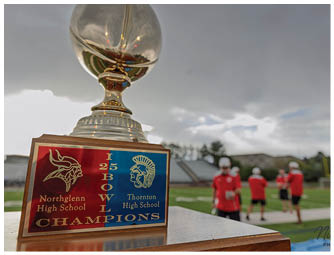 A trophy with a basketball on top of it. Description generated by AI