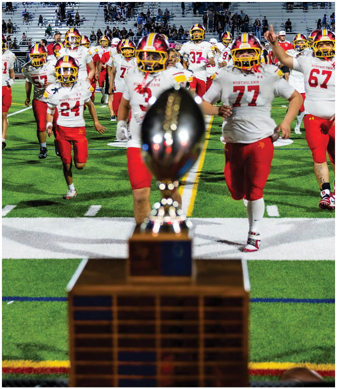 A trophy is on a stand. Description generated by AI