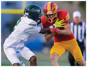 A football player wearing a red helmet and white jersey with the number 7. Description generated by AI