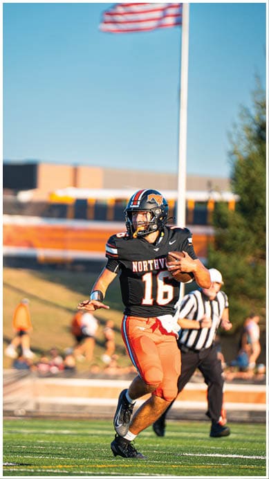 A football player wearing a blue jersey with the number 58 on it. Description generated by AI