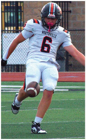A football player catching a ball. Description generated by AI
