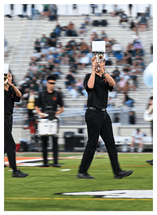 A football player wearing a helmet and white uniform is holding his helmet above his head. AI generated content