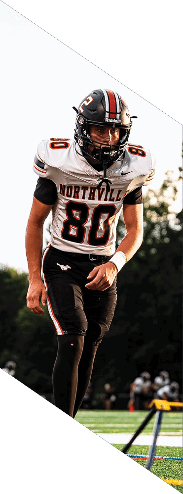 A young man wearing a football uniform is smiling and laughing. AI generated content