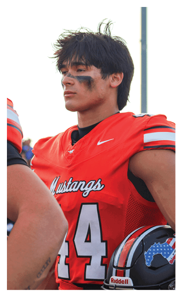 A football player wearing a black and white uniform with the number 10 on the back. AI generated content
