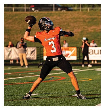 A football player in a white jersey with the number 85 on it is trying to catch a football. AI generated content