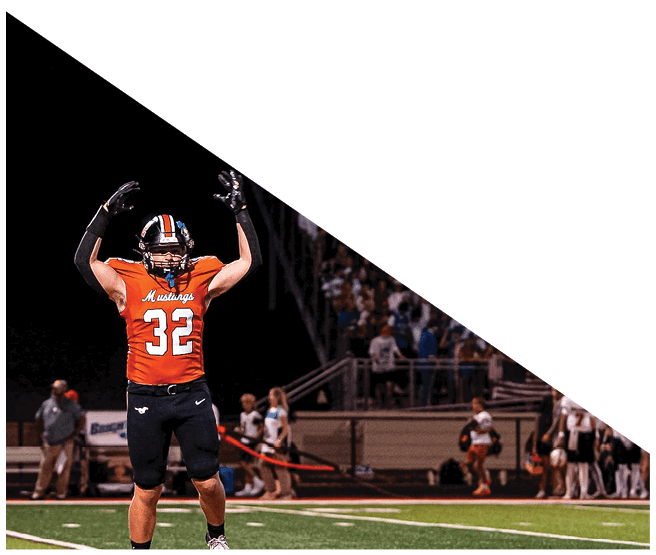 A group of football players kneeling on the field, some with their hands on their heads. AI generated content
