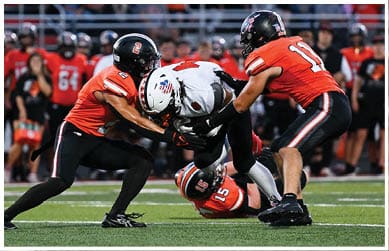 A football player wearing a blue jersey with the number 58 on it. Description generated by AI