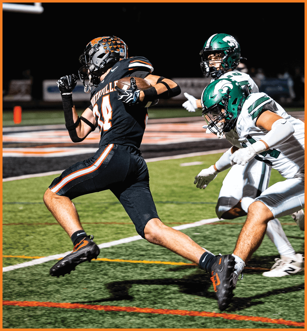 A football player running on the field. Description generated by AI