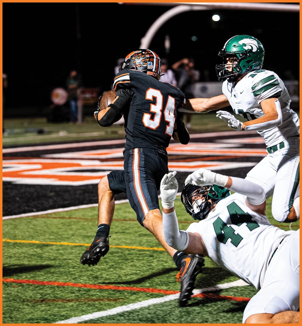 A football player running on the field. Description generated by AI