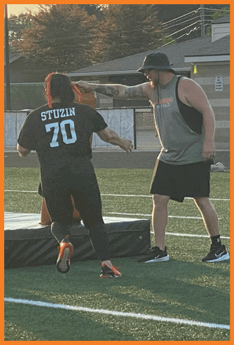 A football game is being played on a field. Description generated by AI