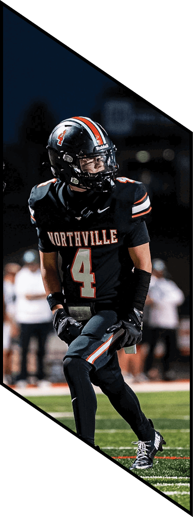 A young man wearing a football uniform is smiling and laughing. AI generated content