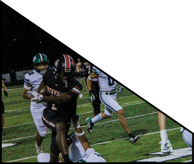 A group of football players kneeling on the field, some with their hands on their heads. AI generated content