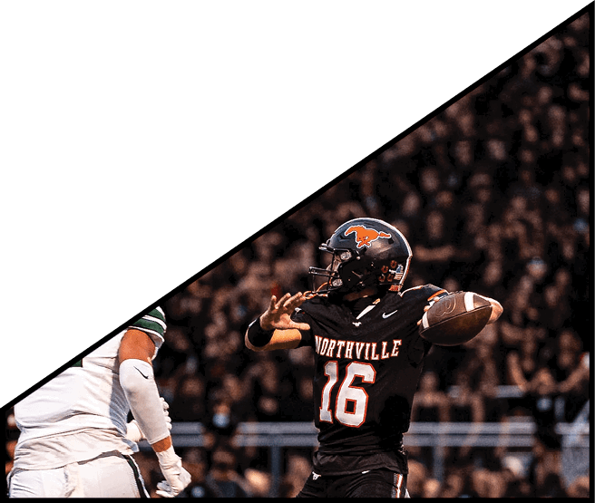 A group of football players kneeling on the field, some with their hands on their heads. AI generated content