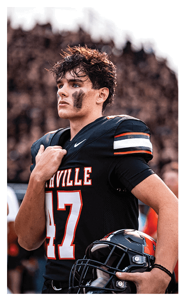 A football player wearing a black and white uniform with the number 10 on the back. AI generated content