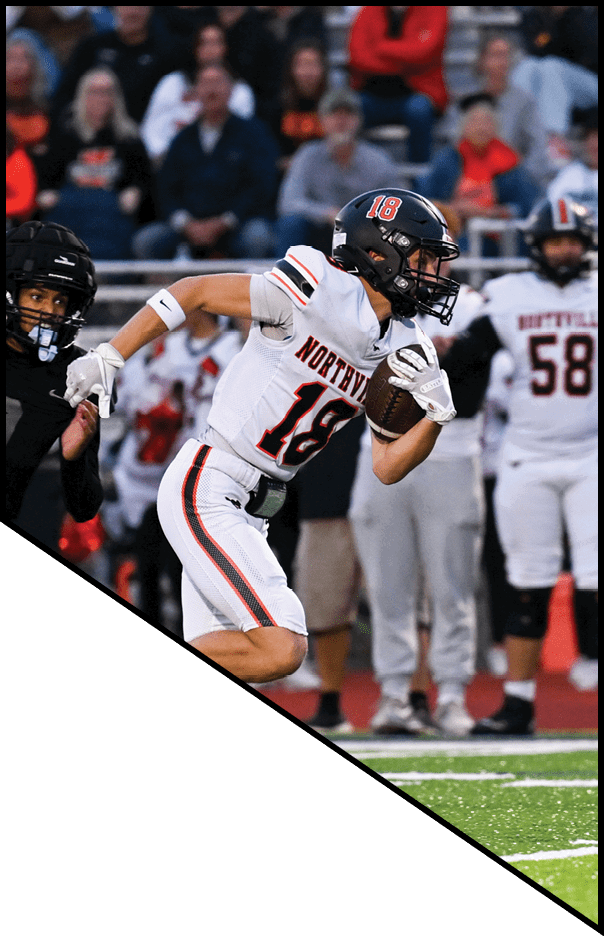 A football player is kneeling on the field, holding his helmet in his hands. AI generated content