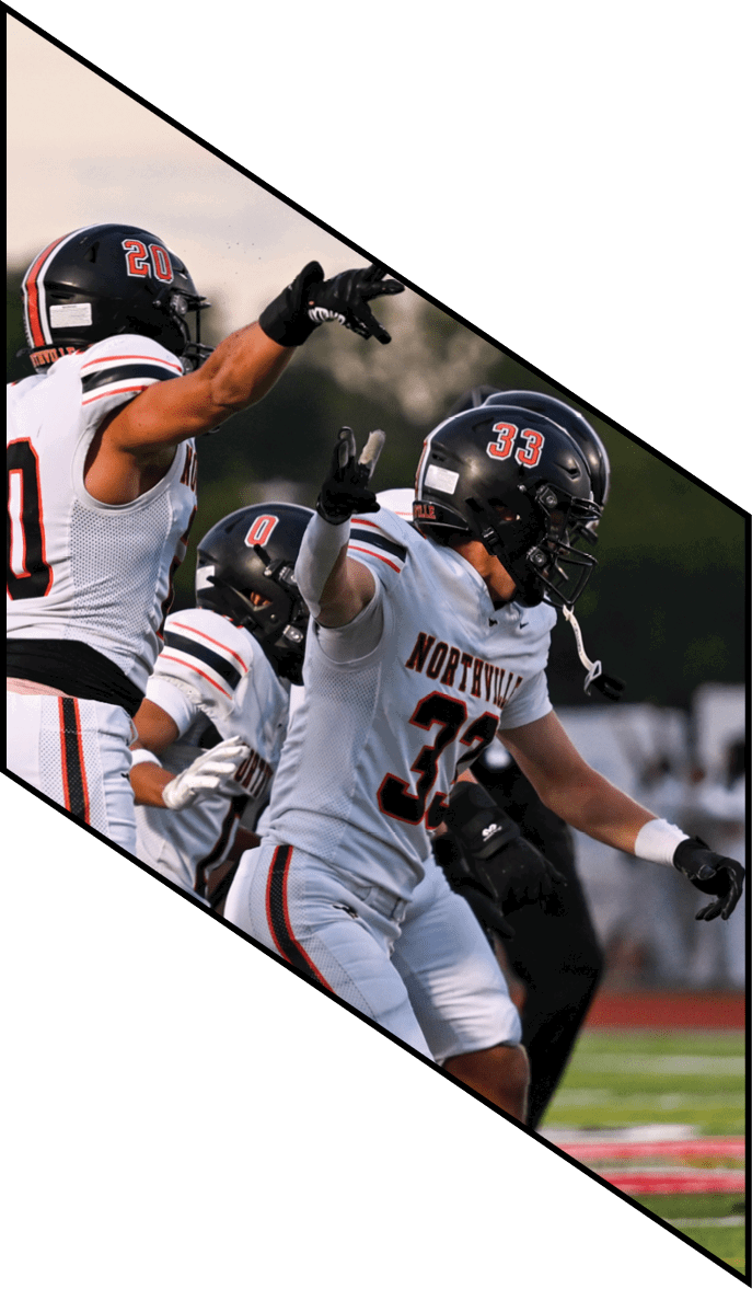 A group of people wearing black jerseys are huddled together on a field. AI generated content