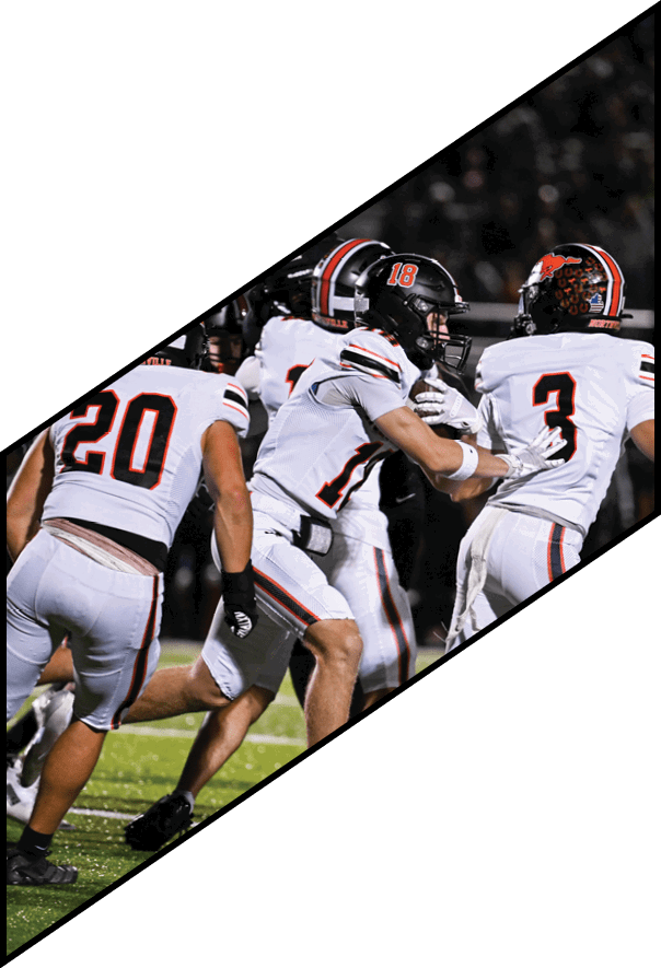 A group of young men wearing black and white uniforms are standing on a field. AI generated content