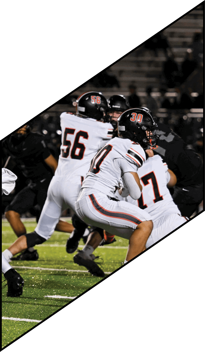 A group of people wearing black jerseys are huddled together on a field. AI generated content
