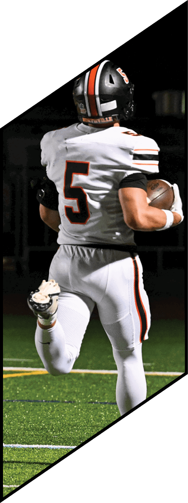 A young man wearing a football uniform is smiling and laughing. AI generated content