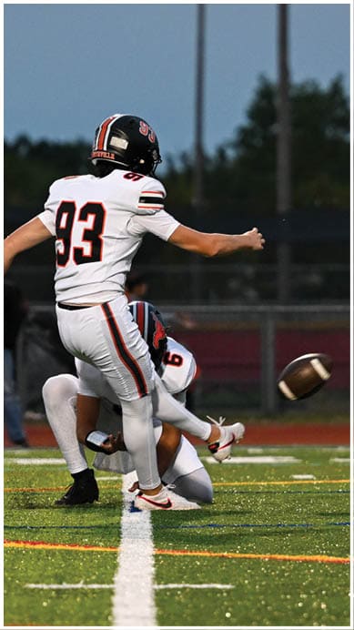 A football player wearing a blue jersey with the number 58 on it. Description generated by AI