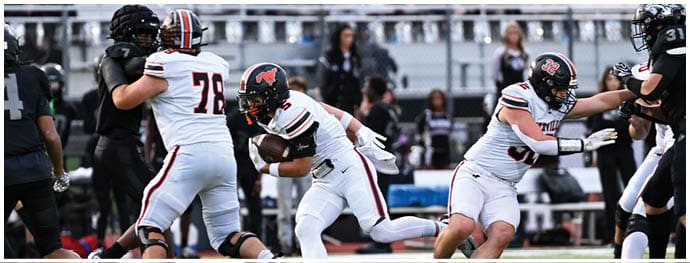 A football player is sliding on the ground. Description generated by AI