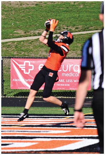 A football game is being played on a field. Description generated by AI
