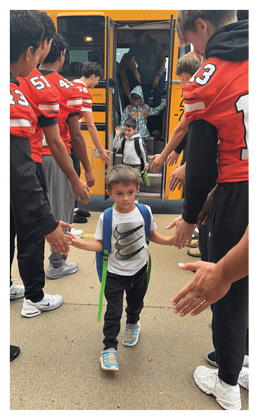 A young man wearing a football jersey with the name Vista on the back. AI generated content