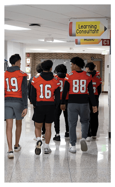 A young man wearing a football jersey with the name Vista on the back. AI generated content