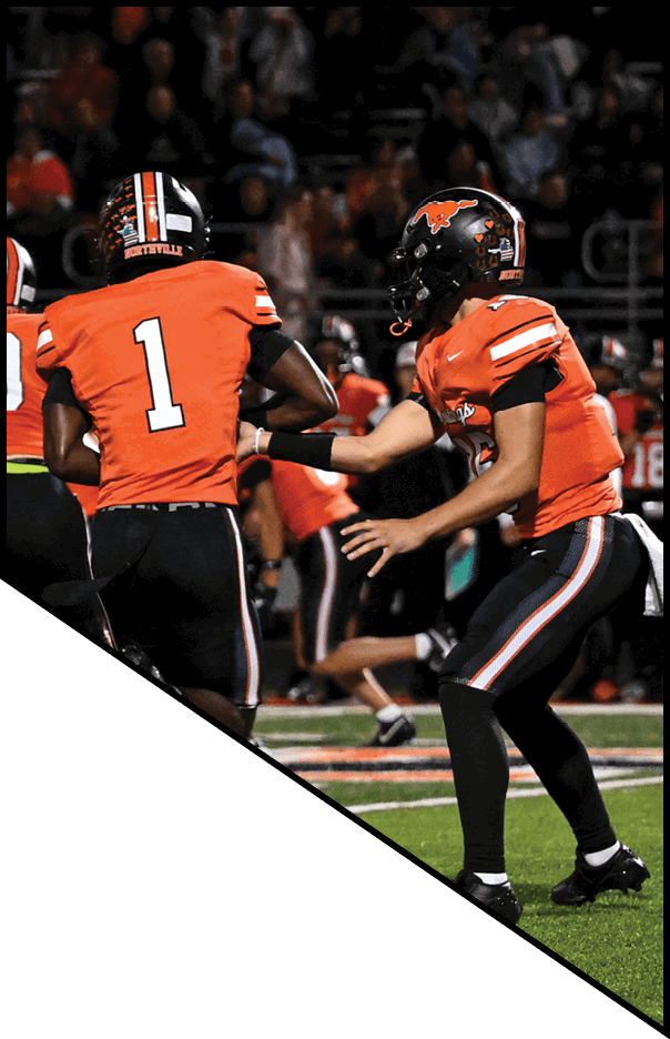 A football player is kneeling on the field, holding his helmet in his hands. AI generated content