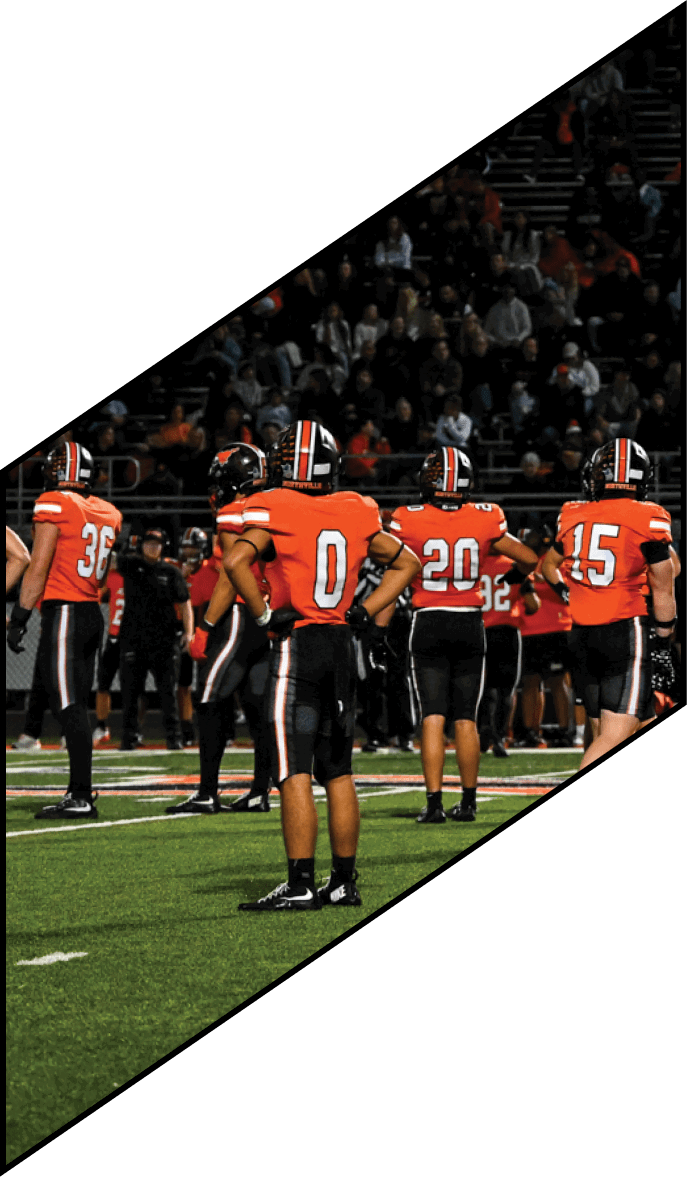 A group of people wearing black jerseys are huddled together on a field. AI generated content