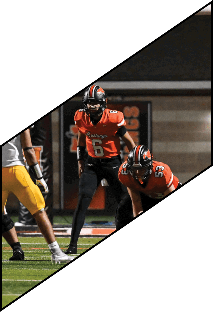 Four football players pose for a picture on the field. AI generated content