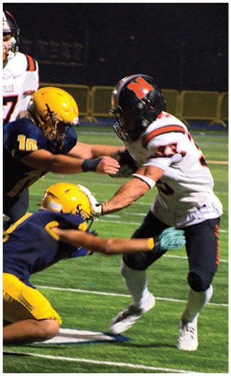 A football player catching a ball. Description generated by AI