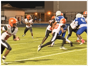 A football player is sliding on the ground. Description generated by AI