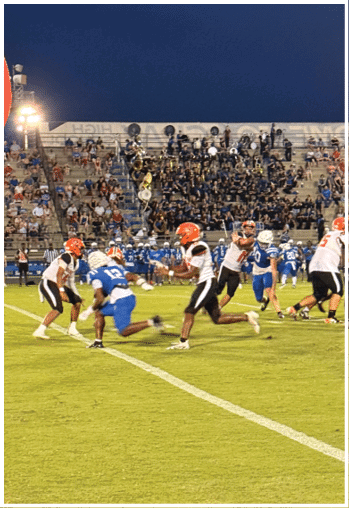 A football player running on the field. Description generated by AI