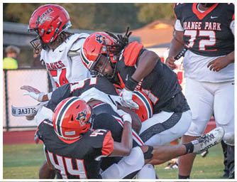 A football player is sliding on the ground. Description generated by AI