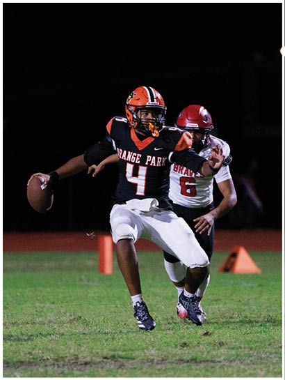 A football player wearing a blue and white uniform. Description generated by AI