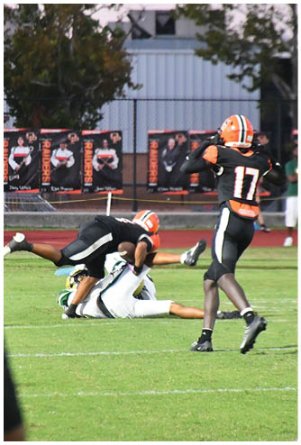 A football player running on the field. Description generated by AI