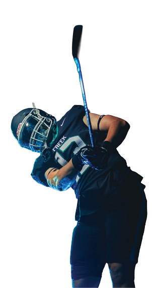 Person wearing sports gear and helmet swinging a golf club against a white background. Description generated by AI