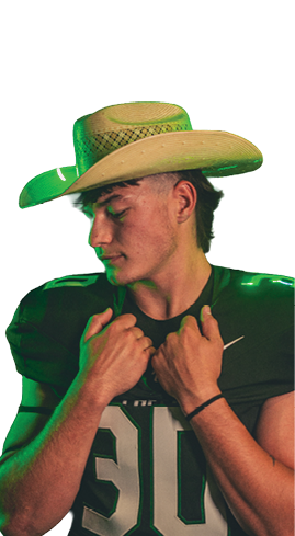 Person wearing a sports uniform with the number 30 and a cowboy hat looking down while holding the collar of the uniform. Description generated by AI
