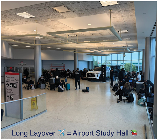 A group of people are gathered in a spacious, modern airport study hall with large windows and a high ceiling. Description generated by AI