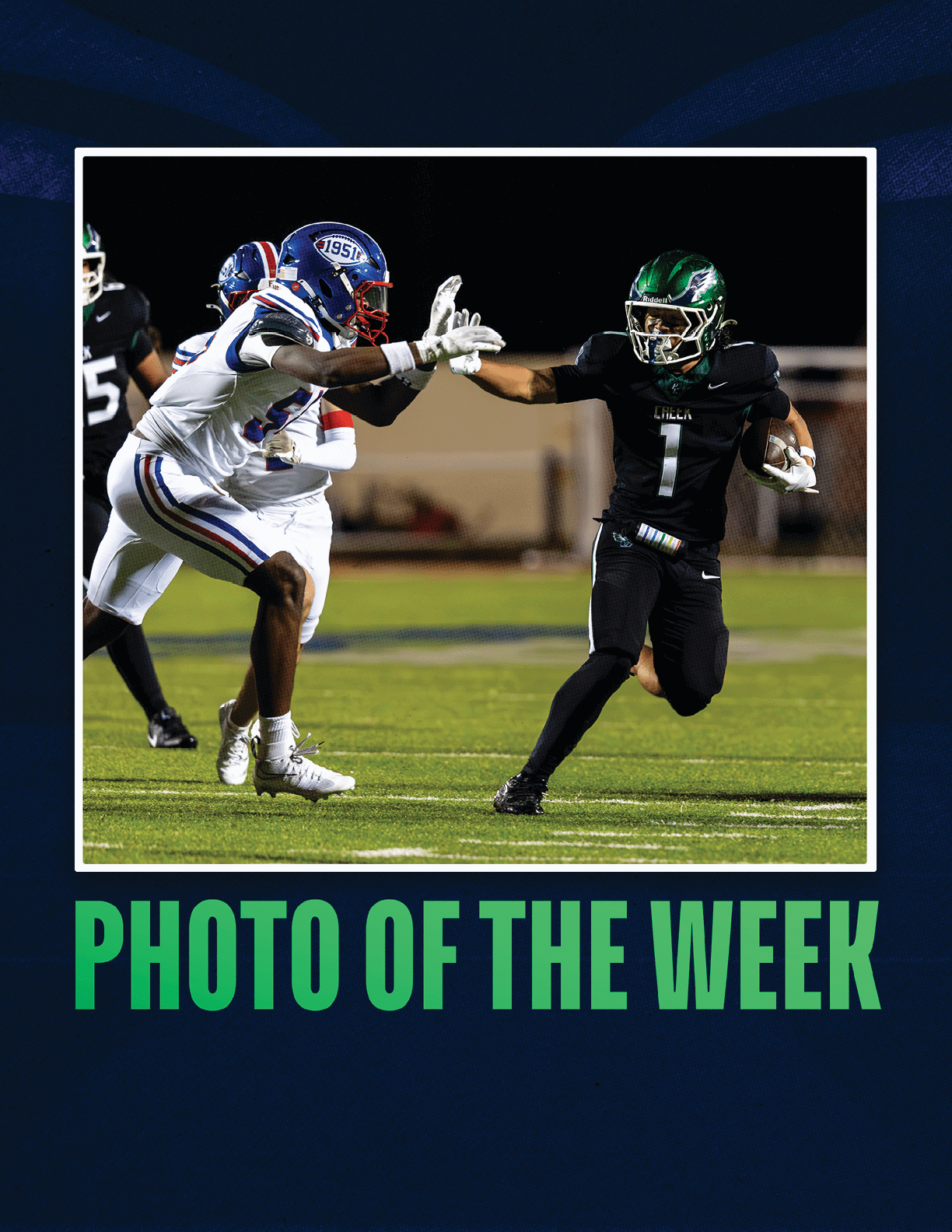 Two people in football uniforms are on a field with one person running with the ball and the other reaching out to block or tackle. Description generated by AI