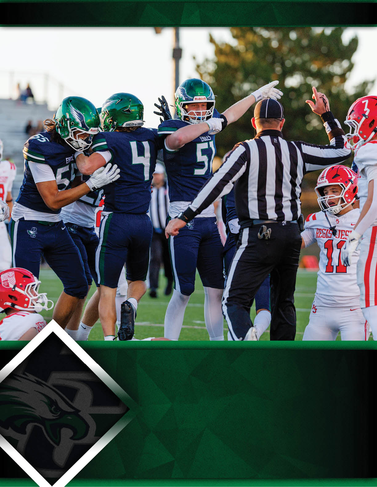 Players in green and blue football uniforms celebrate on the field while a referee and players in white and red uniforms observe. Description generated by AI