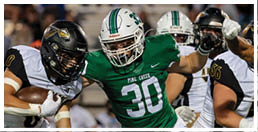 A football player wearing a blue and red jersey. Description generated by AI