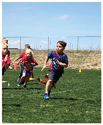 A football player wearing a blue and red jersey. Description generated by AI