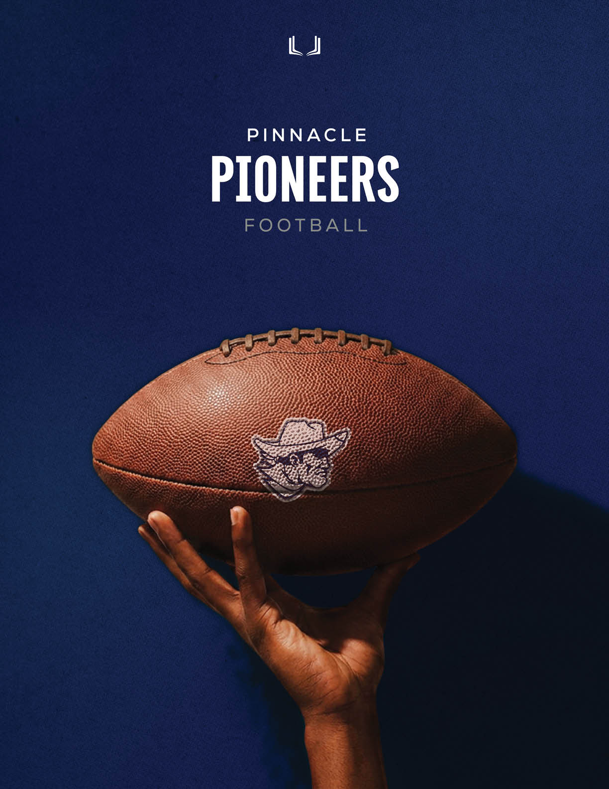 A football is being held by a person. Description generated by AI
