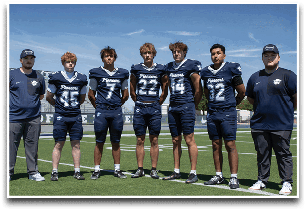 Three football players are standing on the field, one of them is smiling and wearing a black jersey with the number 55. AI generated content