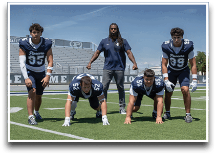 Three football players are standing on the field, one of them is smiling and wearing a black jersey with the number 55. AI generated content