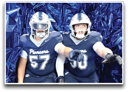 Three football players are standing on the field, one of them is smiling and wearing a black jersey with the number 55. AI generated content