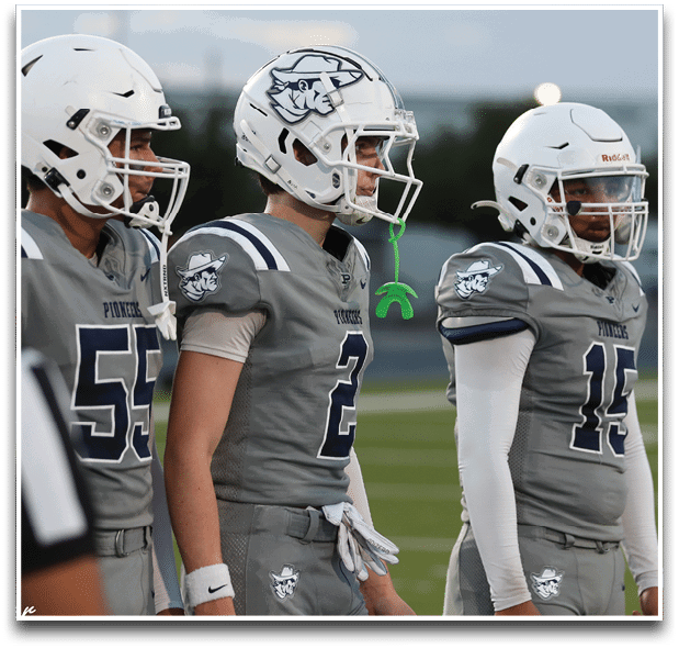Three football players are standing on the field, one of them is smiling and wearing a black jersey with the number 55. AI generated content